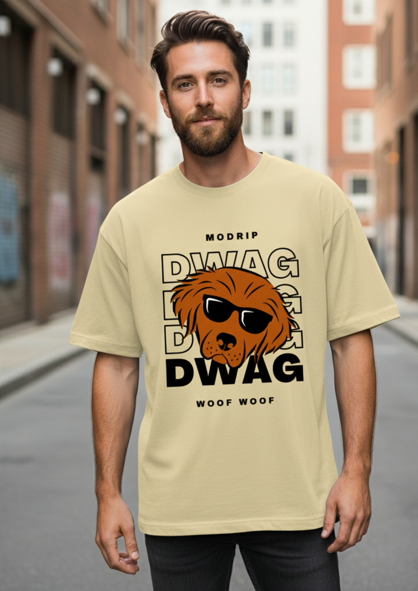 Man wearing a beige t-shirt with a graphic design of a dog and text on a city street.