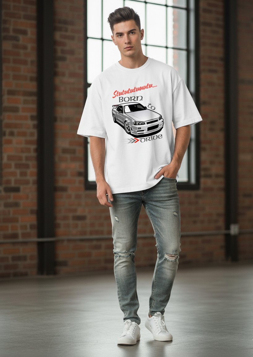 Man wearing a white t-shirt with a graphic design in an indoor setting with brick walls.