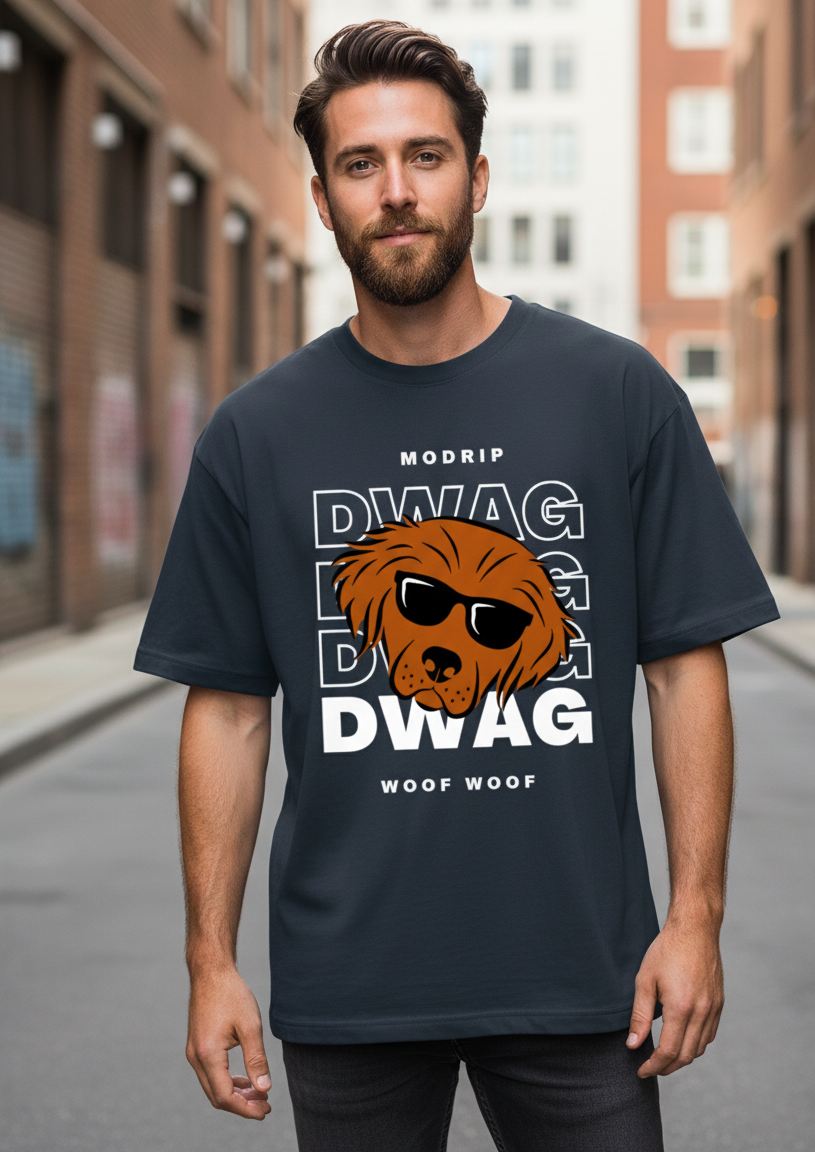 Man wearing a navy blue t-shirt with a graphic design on a city street.