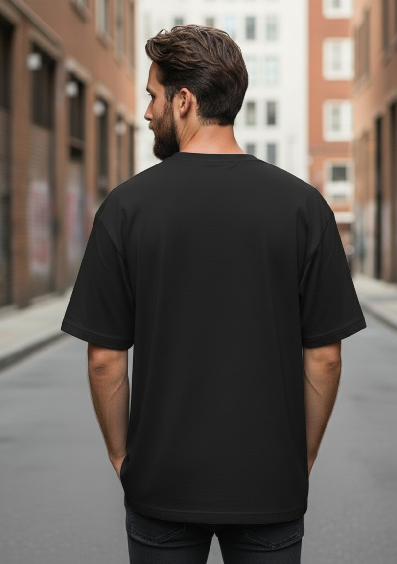 Man wearing a black t-shirt on an urban street