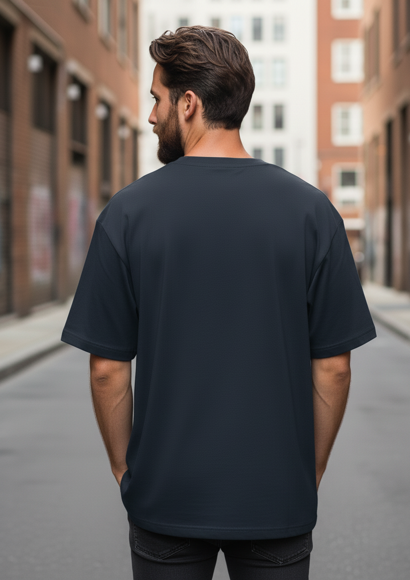 Man wearing a navy blue t-shirt on an urban street
