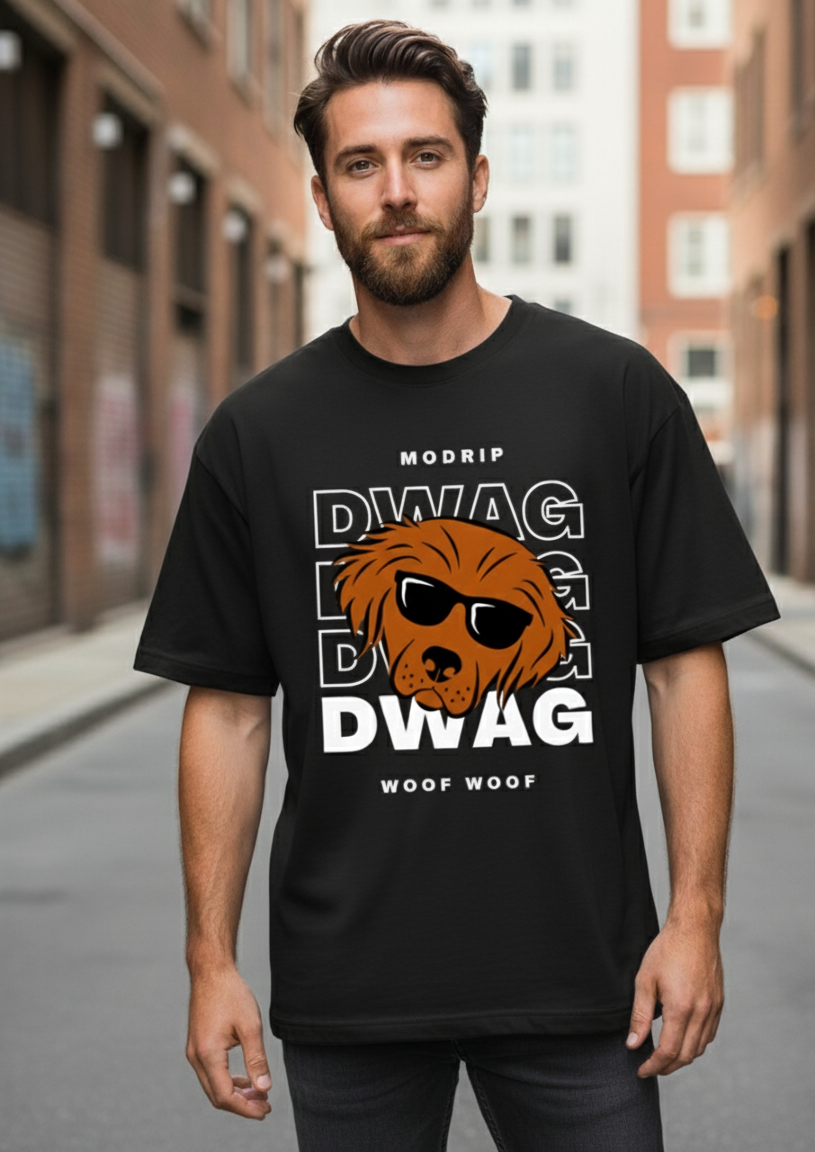 Man wearing a black t-shirt with a graphic design on a city street