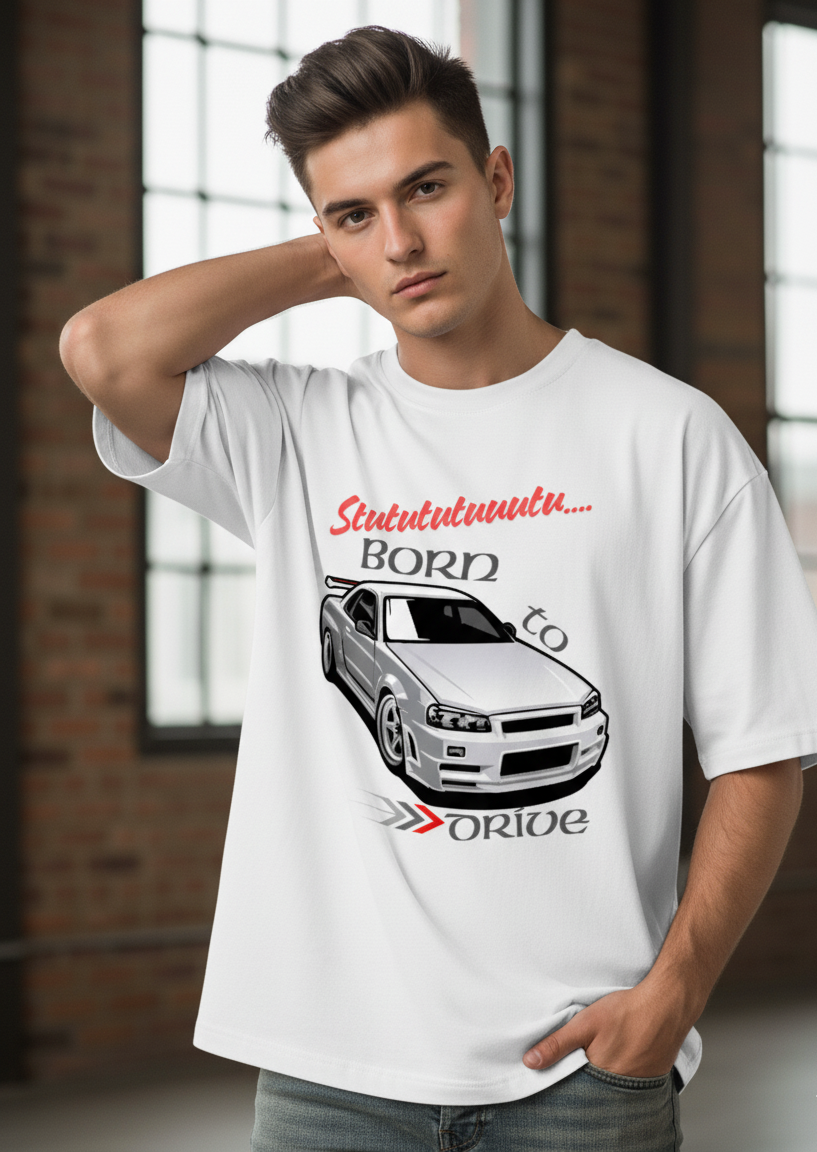 Person wearing a white t-shirt with a car graphic and text in an indoor setting
