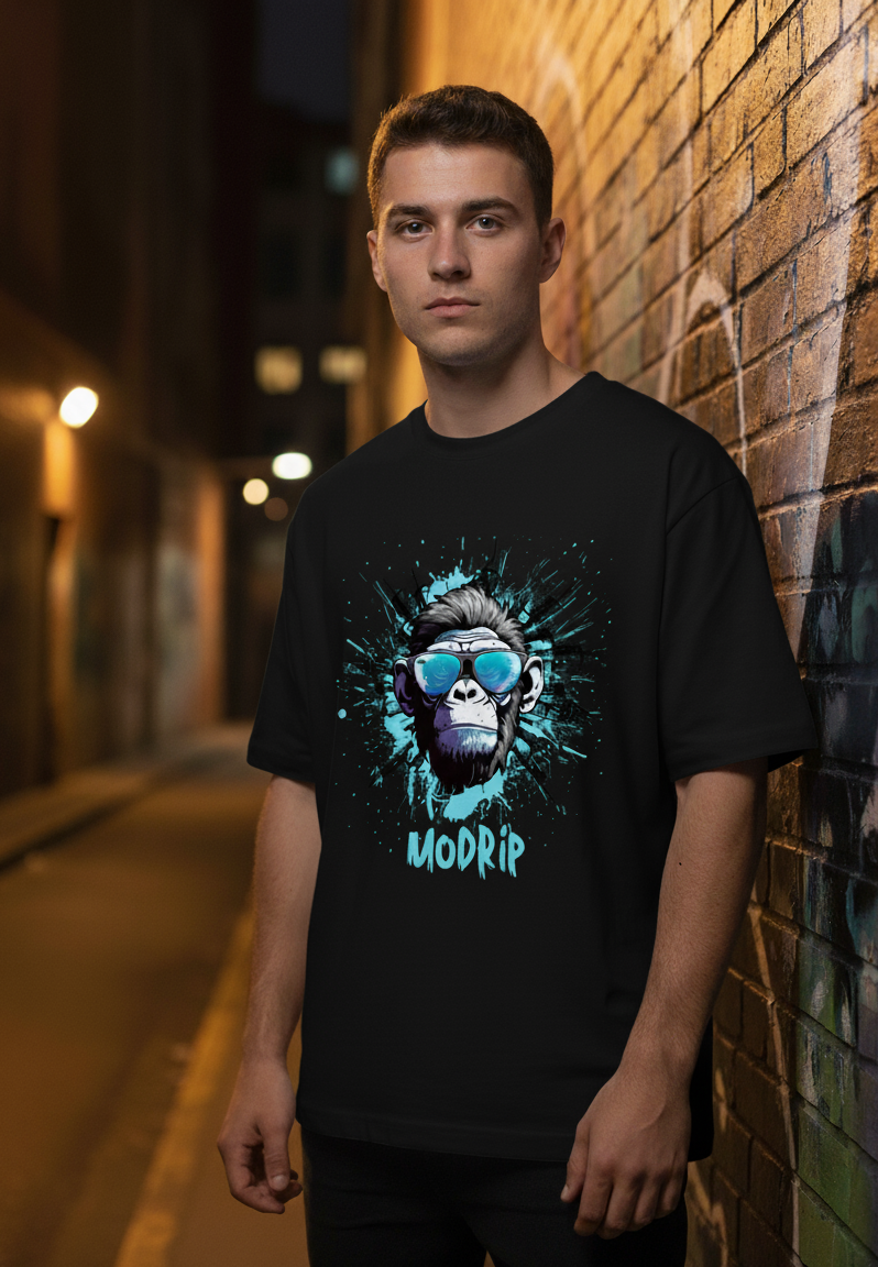 Man wearing a black t-shirt with a graphic design of a monkey wearing sunglasses and the word 'MODRIP'.