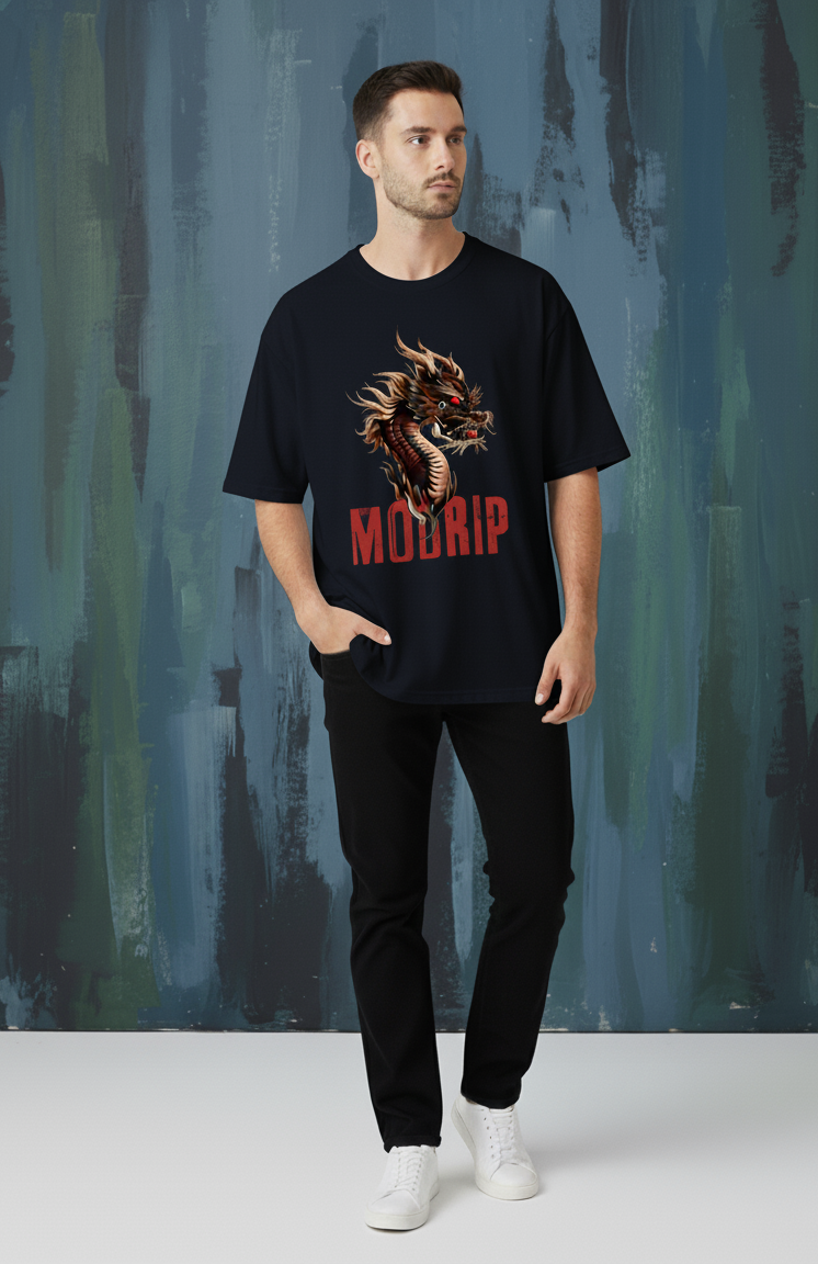 Man wearing a black t-shirt with a dragon graphic and 'Modrip' text against a textured wall.